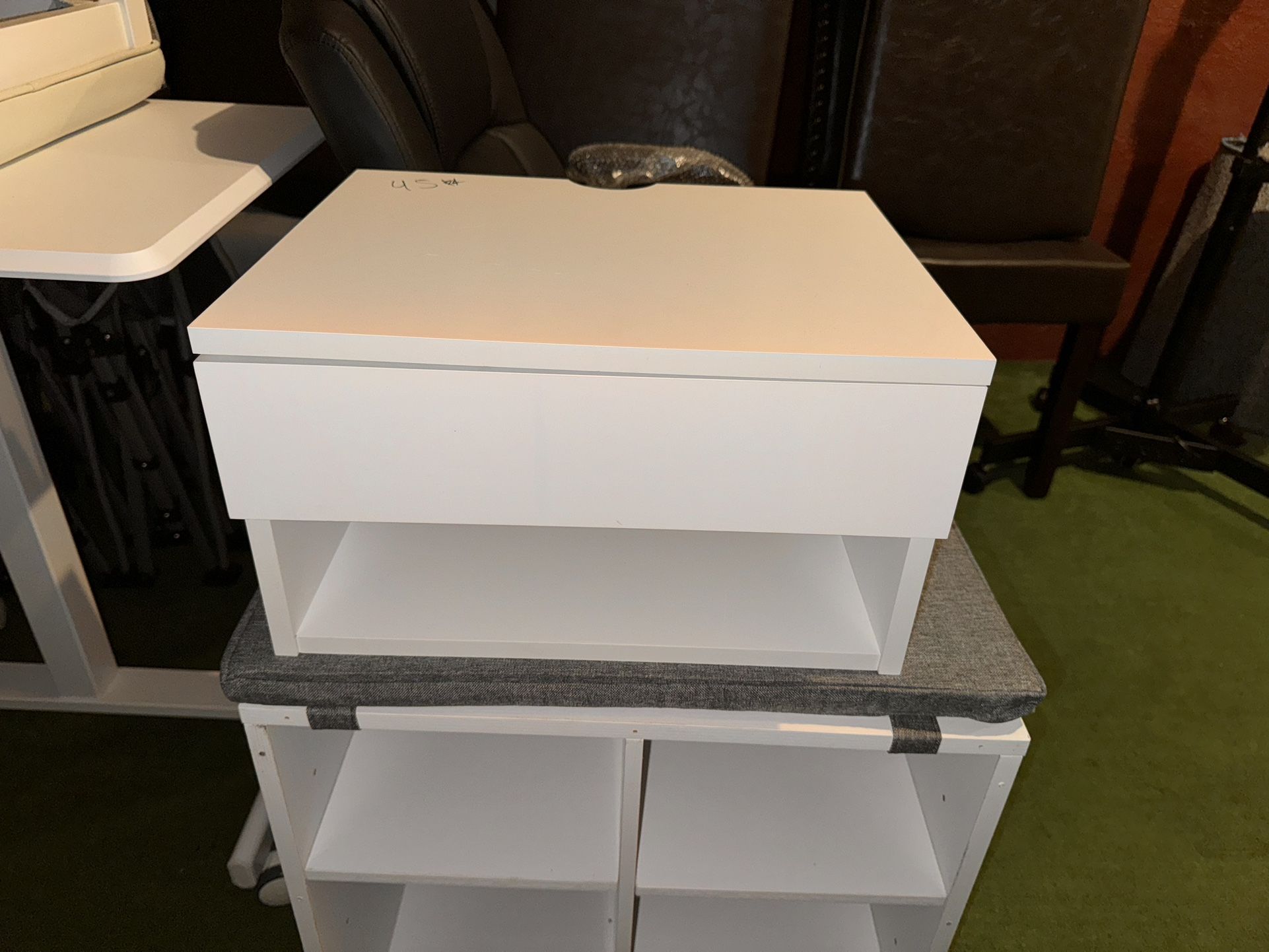 a white storage unit with a drawer on top and an open shelf below, pickup and cash $45