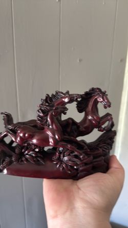 cinnabar-style sculpture depicting running horses