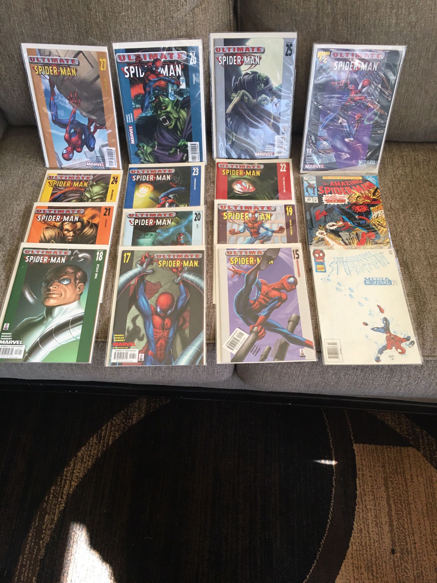 Spiderman comic books 15 pieces five dollars each or $60 for all, like new in plastic