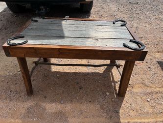 Rustic Wooden Table with Horseshoe Accents