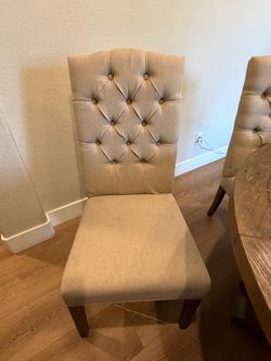 5 tufted dining chairs.