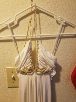 White dress made with gold jewel