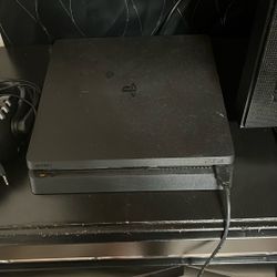 PS4 with 2 controllers, charger and HDMI cord