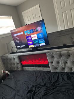 PLATFORM BED WITH TV COMING OUT OFHEADBOARD