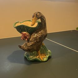 old duck with a flower candy dish