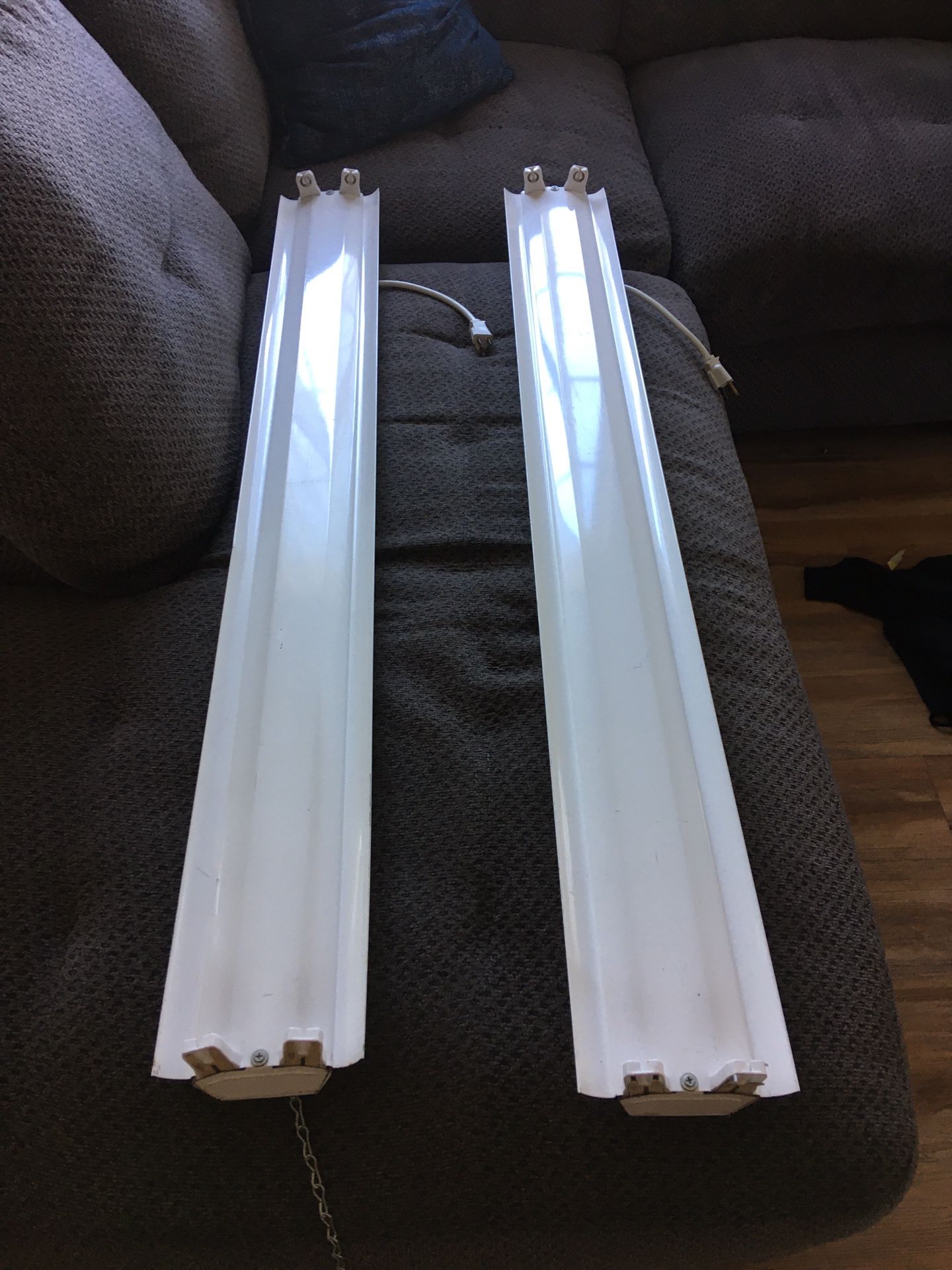 Pair of fluorescent light fixtures