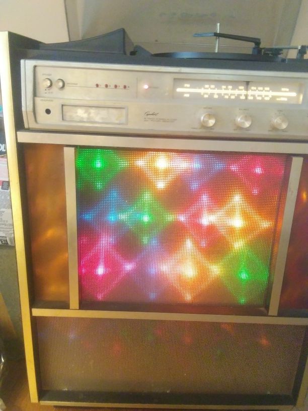 Vintage Capehart disco light up to music.. AM/FM stereo receiver, 8-track, record player..built in speakers