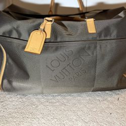 Louis Vuitton Souverain Duffle Bag made of Damier Geant canvas.
