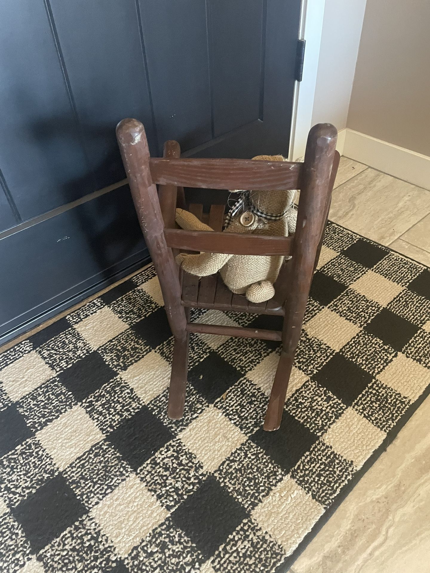 Old, brown, solid wood children’s rocker