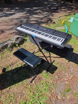 Casio Keyboard w/ Pedal and rolling case.