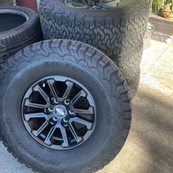 17” FORD RAPTOR WHEELS WITH BFG TIRES.