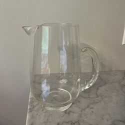 Beautiful large clear glass pitcher with heavy base spout and thick handle.