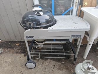 Prices firm.. Weber large 22-in kettle charcoal barbecue with prep table