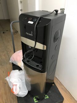 Hot and cold water dispenser used as is powers on