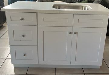 Kitchenette with quartz countertop and sink