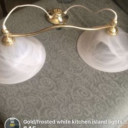 Gold/frosted white kitchen island fixture.