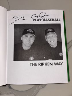 Cal Ripken, Jr. and Billy Ripken signed HC book, ‘Play  Baseball The Ripken Way’.