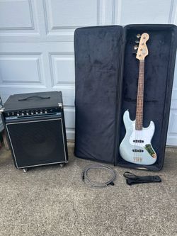 Fender Squier Bass and Acoustic B-100 package. Also included: nice semi hard case, locking strap and guitar cord.    All items are in good condition. 