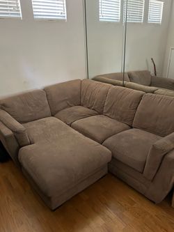 Three piece brown sectional couch