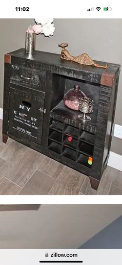 old world style wine cabinet in NY motif by Frontgate