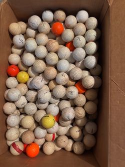 Box of practice golf balls. (250) All different kinds.