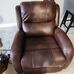 2 brown leather chairs