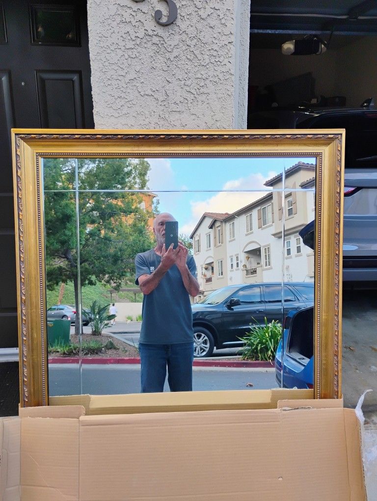 Beveled Mirror In Ornate Wood Carved Gold Frame