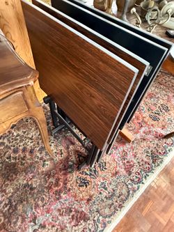 Tv tray tables (4) and base they store on