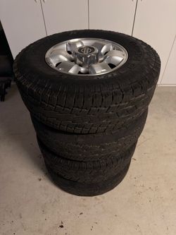 Nissan Factory 15" Wheels with Toyo Open Country A/T Tires (30x9.50R15LT) - Set of 4