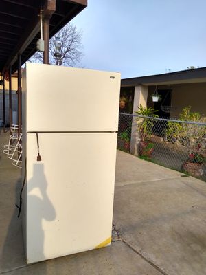 Photo Fridge. It works but is dripping little water from freezer down to fridge.threw the inside.very small amount. Obo