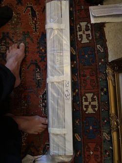 NIB: pair of white faux wood blinds. 31.5”x33”