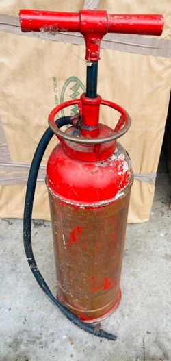 Antique hand pump fire extinguisher