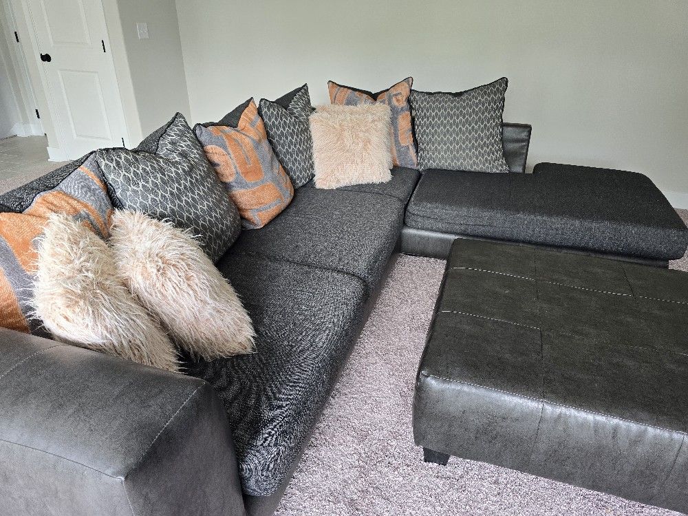 Charcoal Gray Sectional Sofa with Ottoman & Pillows – Fair Condition