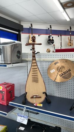 Traditional Vietnamese Đàn tỳ bà lute, often featuring intricate mother-of-pearl inlay work.