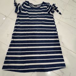 Stylish women dress with navy and white stripes.