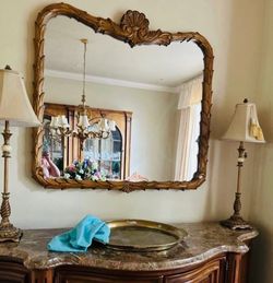 Large decorative ornate mirror with carved wood