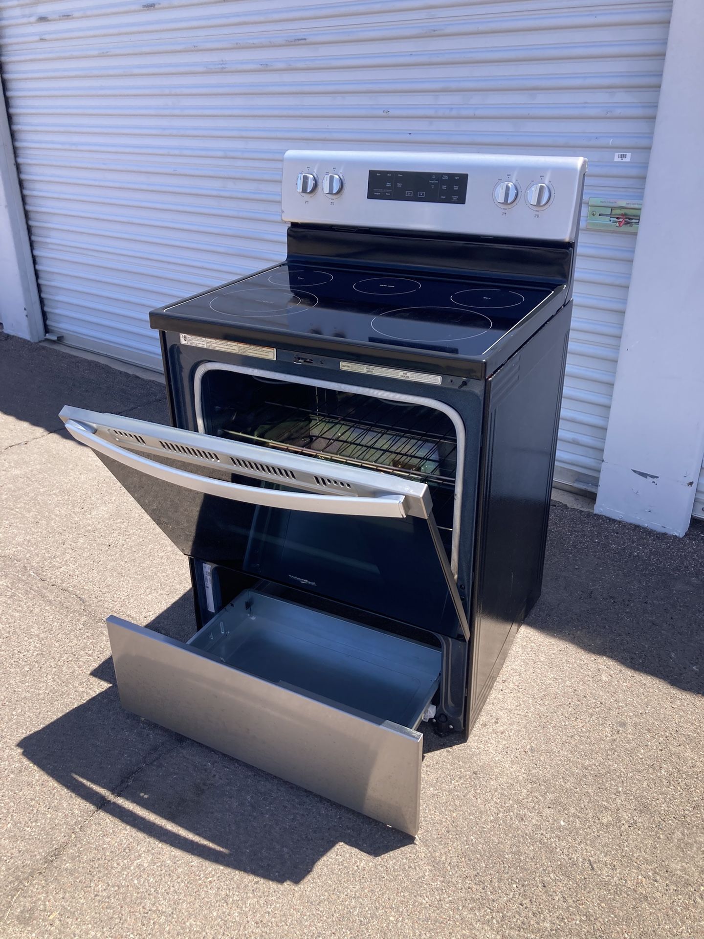 Whirlpool stainless steel electric stove working very well, clean and nice, one month warranty, delivery available, the drawer under the stove has som