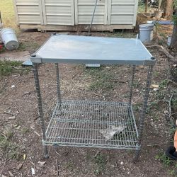 A metal table it’s 34 inches tall 30 inches wide and 24 inches deep
