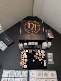 Coins and paper currency for sale.