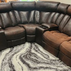 7 Piece Power recliner leather sectional. 3 power recliners with 4 cup holders and 4 usb charging