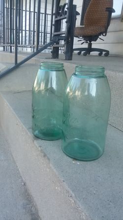 2 half gallon Ball mason jars dark green tinted with numbers on the bottom of the jar in perfect condition only 50$ for both