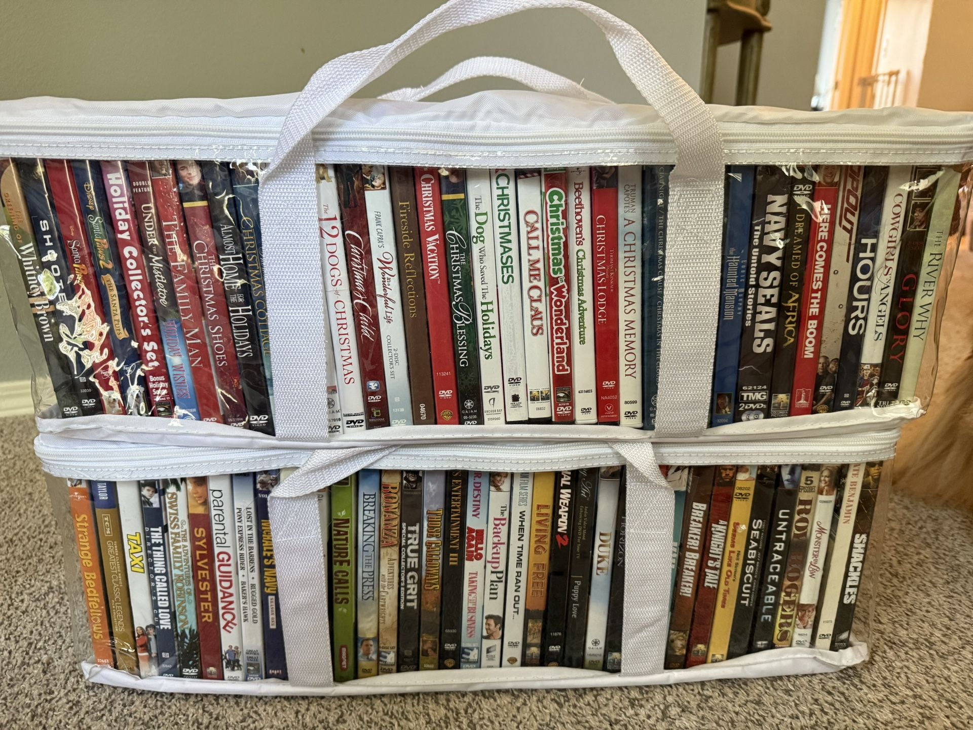 Two White Zip Cases Of DVD Movies - Zip Cases Included