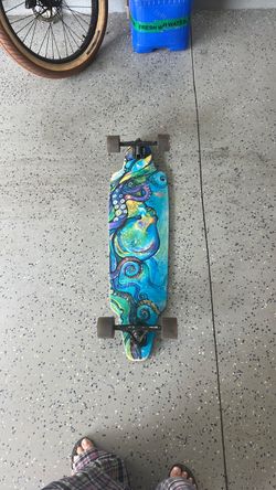 Dusters 38” Kraken Longboard  Dusters California 38” longboard with colorful Kraken/octopus design. Complete with trucks and wheels. Good used conditi