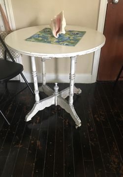 Antique table has the wheels on the bottom that good condition