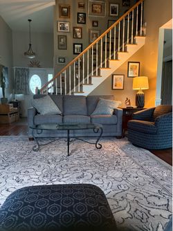 Very heavy glass coffee table with wrought iron base