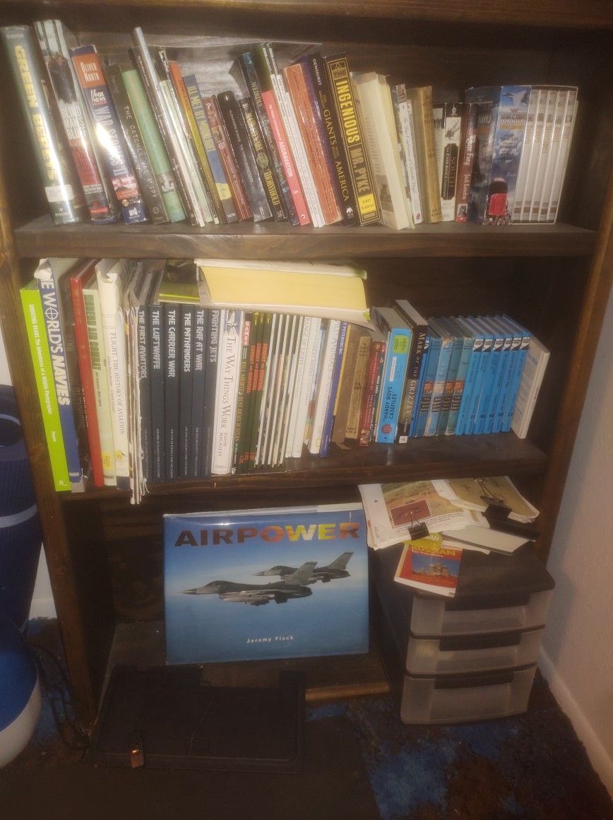 Nice Wood Book Shelf With A Bunch Of Cool Books