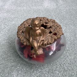 Vintage Avon glass potpourri bowl with gold toned lid topped with seated cherub angel