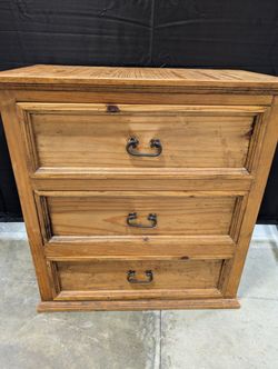 Rustic Pine Three-Drawer Dresser with Dark Metal Pulls