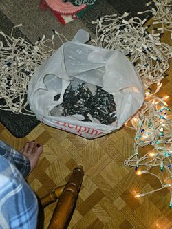 4 sets of Christmas icicle lights with gutter hooks