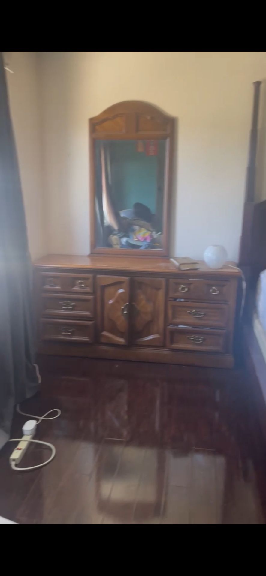 Brown wood dresser with mirror